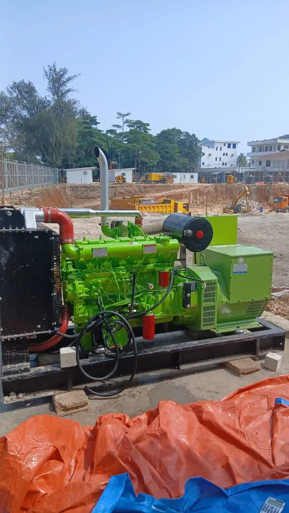 Open green generator set at an active construction site