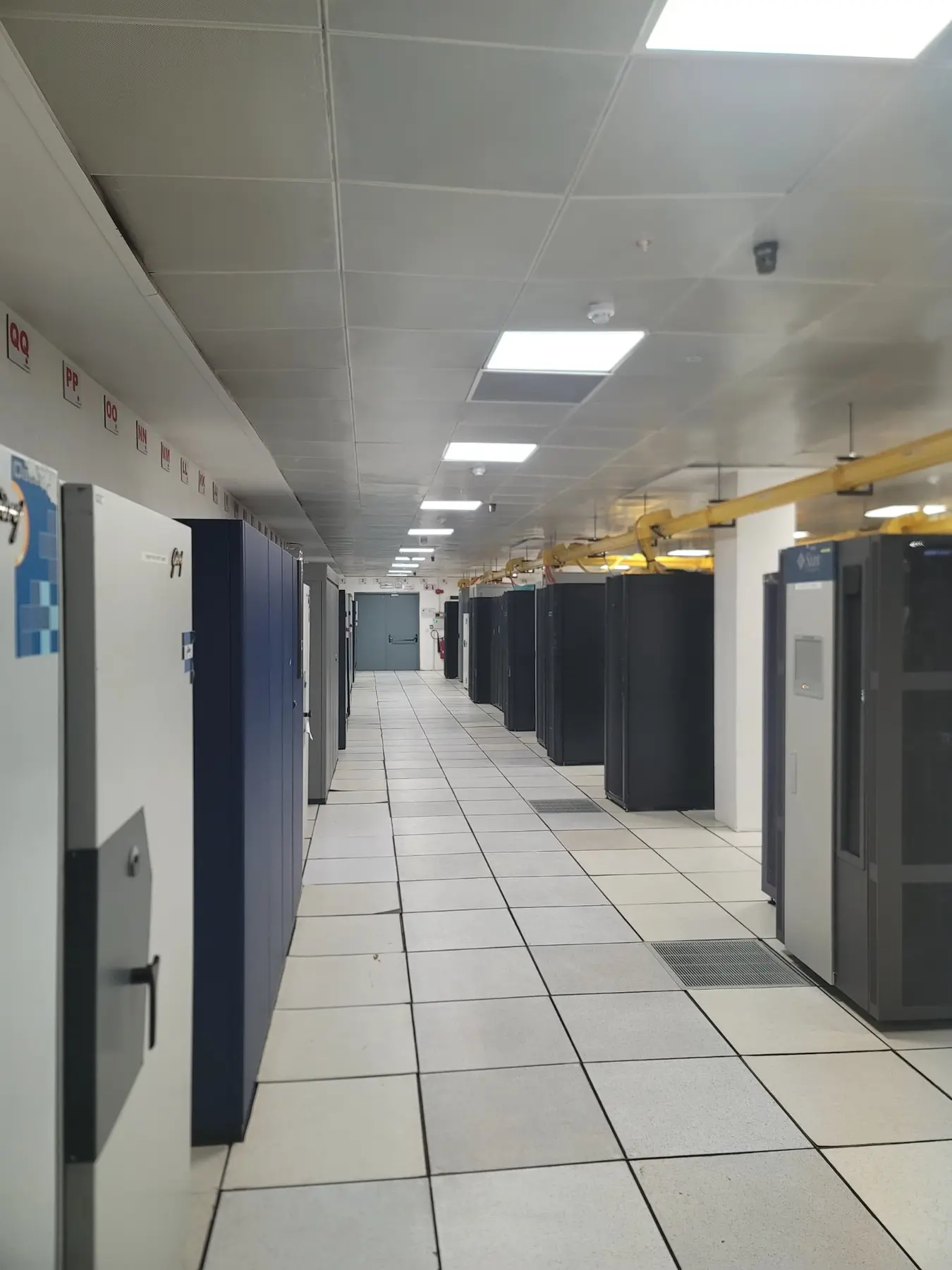 Long equipment corridor inside a critical-load facility