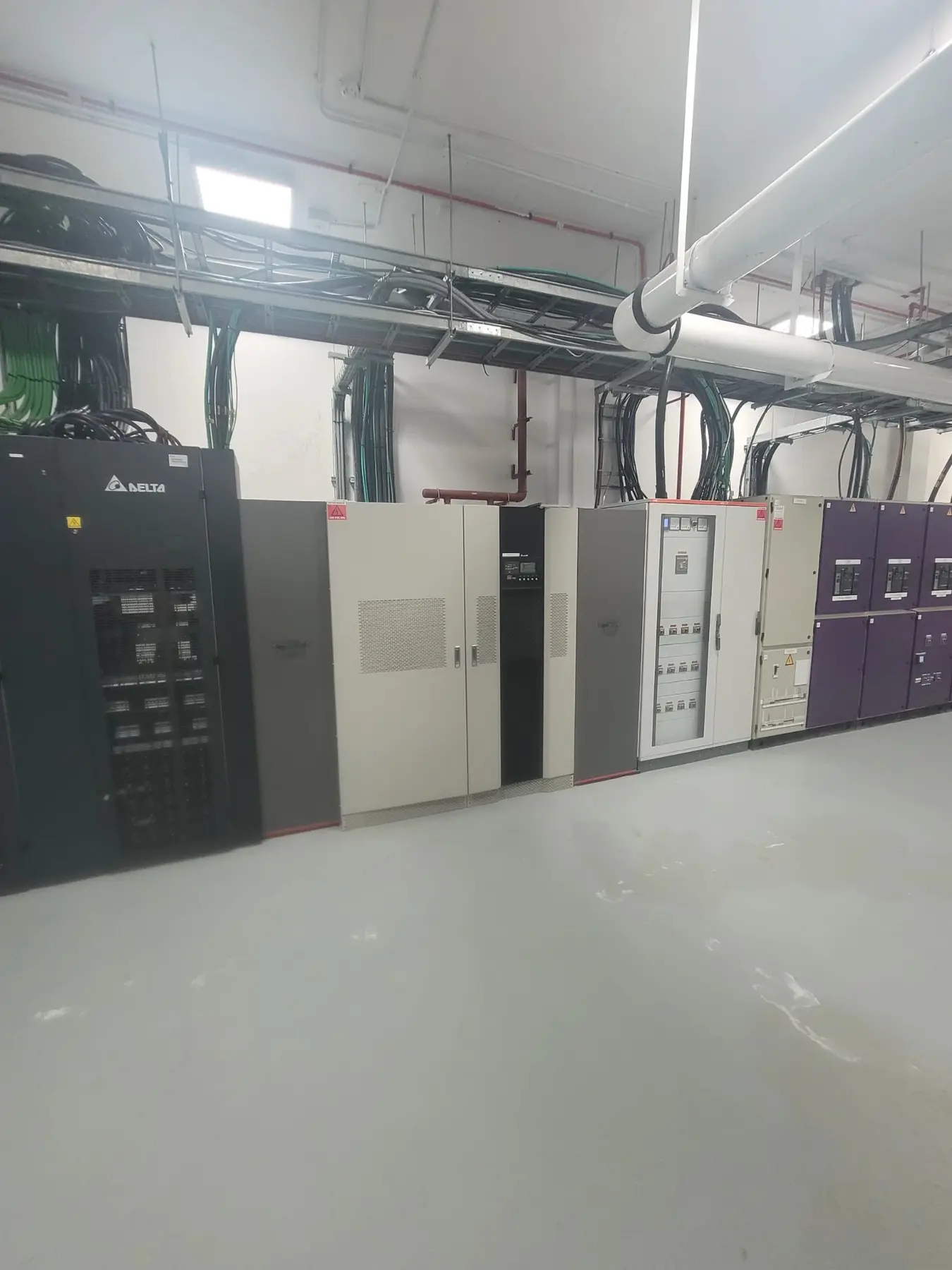 UPS and electrical distribution cabinets with overhead cabling